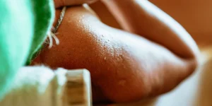 a person's arm with sweat on it