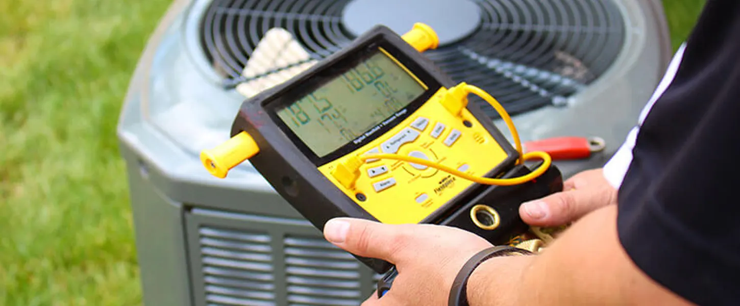 a person holding a digital device to repair an air conditioner